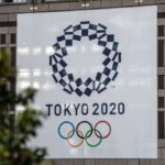 tokyo-2020-olympics-banner-is-displayed-on-a-building-on-news-photo-1584975427