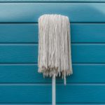 close-up-of-mop-against-wooden-wall-royalty-free-image-914213850-1537883746
