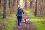 fit-blond-woman-jogging-with-her-dog-royalty-free-image-1588273118