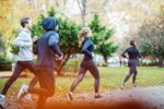 small-group-of-people-running-in-the-autumn-park-royalty-free-image-1588272669