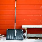snow-shovel-propped-against-side-of-barn-royalty-free-image-917180522-1537884765