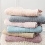 stack-of-clean-soft-colorful-towels-flowers-on-royalty-free-image-1588170875