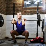 woman-exercising-in-home-gym-in-converted-garage-royalty-free-image-1597155924