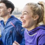 male-and-female-runners-running-and-laughing-royalty-free-image-1610544922