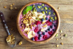 Smoothie,Bowl,With,Fresh,Berries,,Nuts,,Seeds,And,Homemade,Granola
