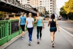 fitness-group-cooling-down-after-city-run-royalty-free-image-1675116387 (1)