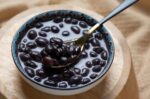 eating-the-black-beans-in-sweet-coconut-milk-soup-royalty-free-image-1688043913